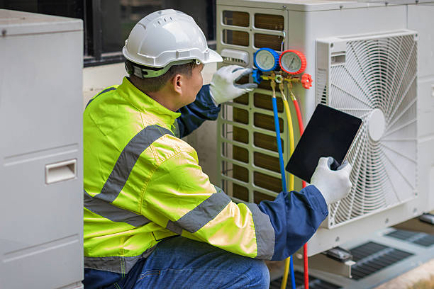 Professional Air Conditioning Repair technician working in Harlan, IA